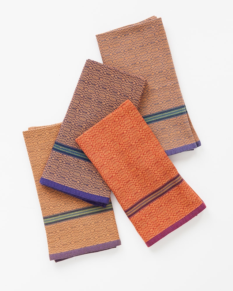 The Mungo boma cloth napkin is available in wide variety of colours - these in orange rust, orange stone, orange indigo and orange sand. Find the one to suit your home.