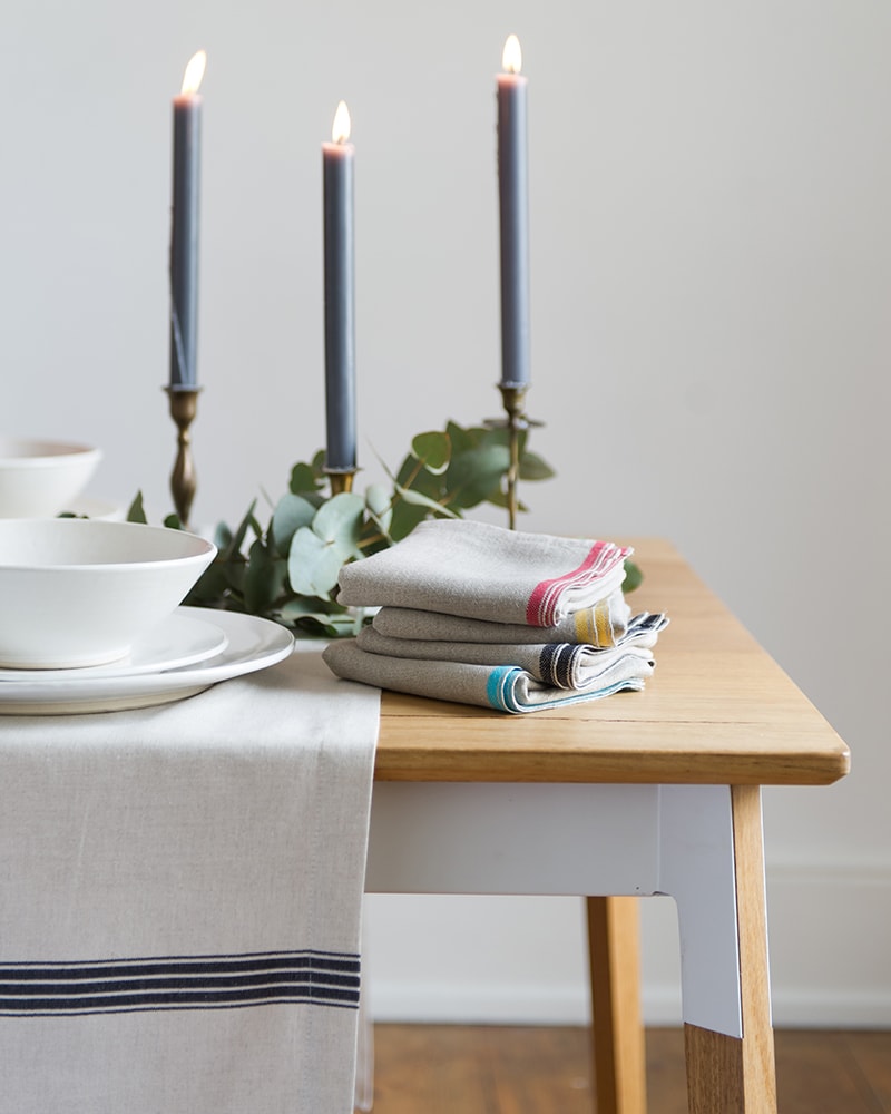 Table setting inspiration, pair the simple provincial stripe tablecloth with the selvedge napkins to add a pop of colour to you table, natural fibre table linen woven at the mungo mill in plettenberg bay