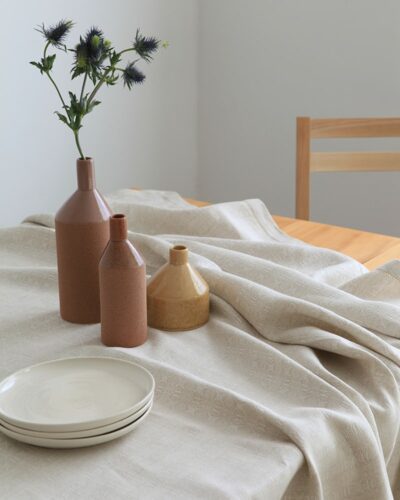 Mungo Cloverleaf Table Linen. Pure linen tablecloths & napkins with an intricate four-leaf design. Woven at the Mungo Mill in Plettenberg Bay