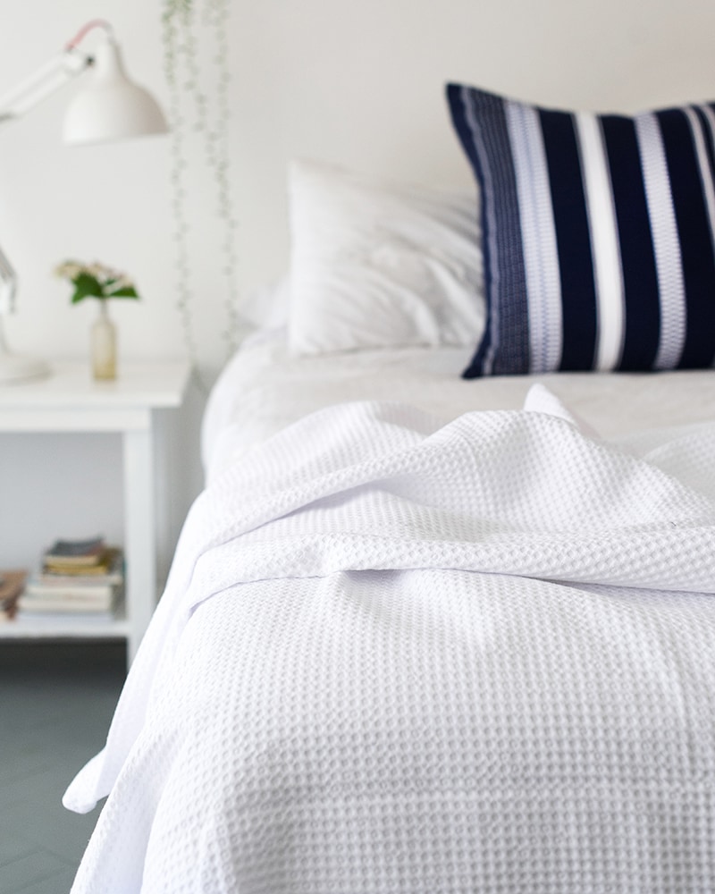 Mungo Cobble Weave bed cover in minimalist bedroom scene
