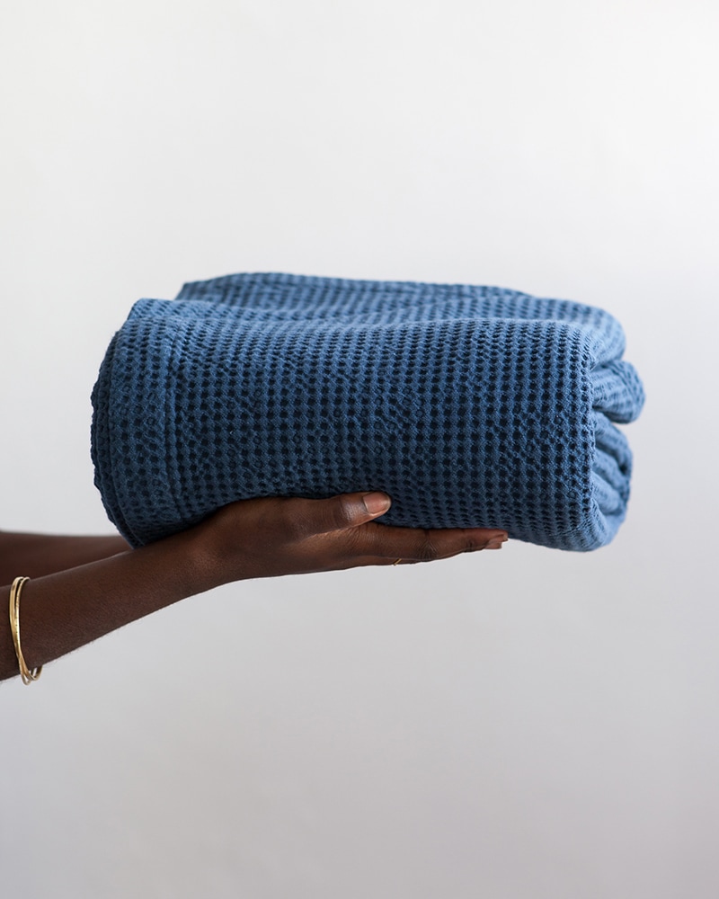 Mungo Cobble Weave bed cover in petrol blue woven in our independent mill in Plettenberg bay