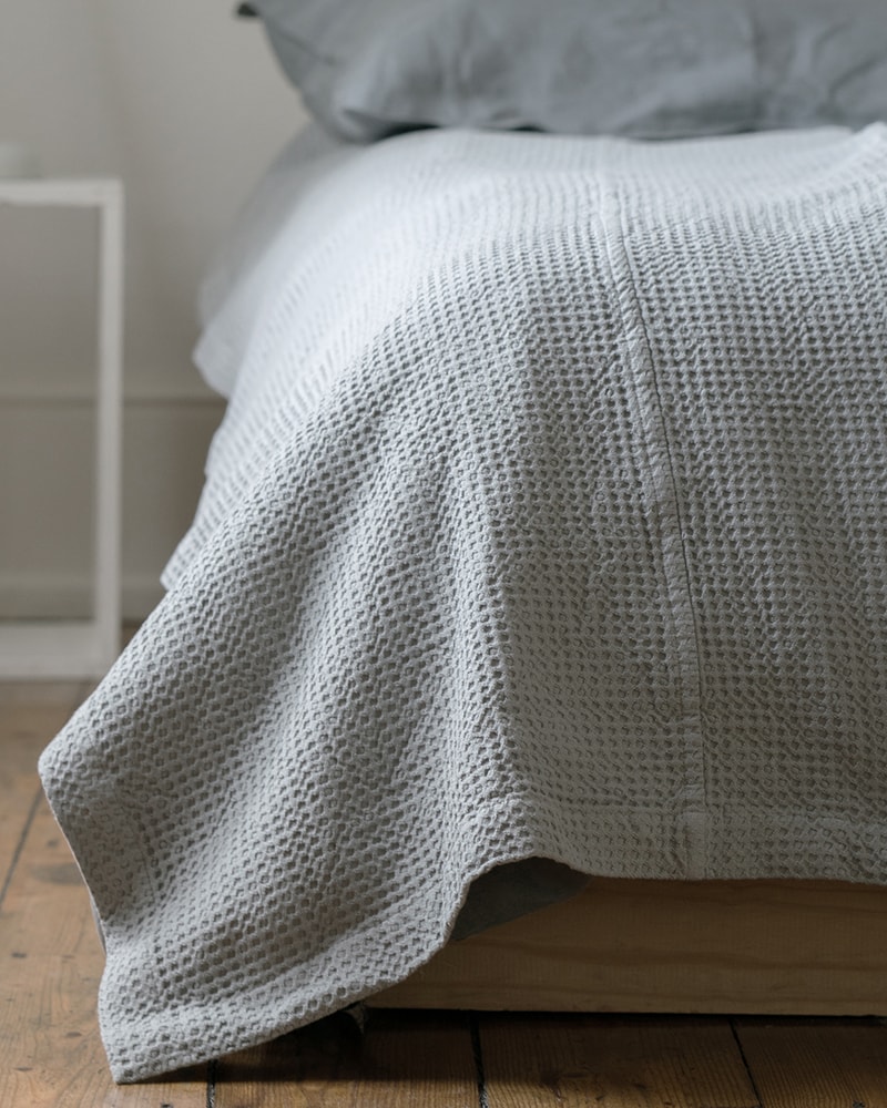 Mungo Cobble Weave bed cover in minimalist bedroom scene