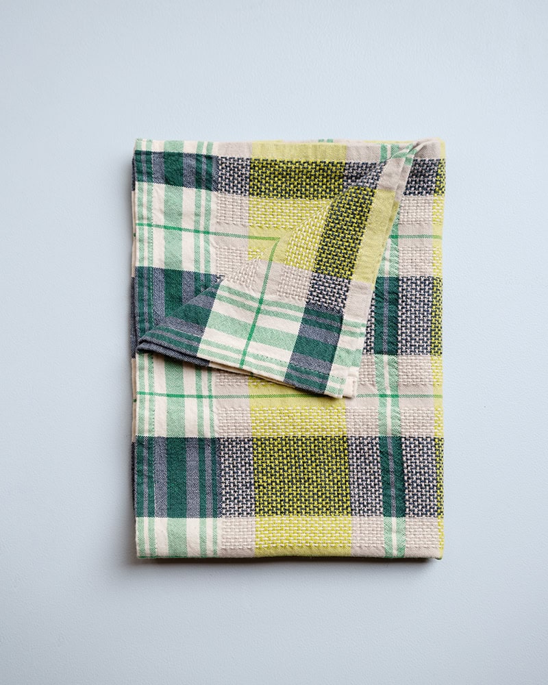 Folded Mungo Vadoek in Dill, woven with 100% cotton at the Mungo Mill in Plettenberg Bay