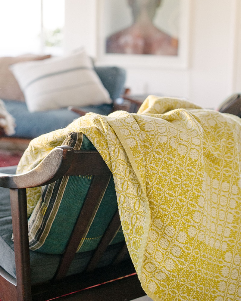 Mungo Juno Throw in Mustard. 100% cotton throw, inspired by traditional 18th century American coverlets. Woven at the Mungo Mill in South Africa