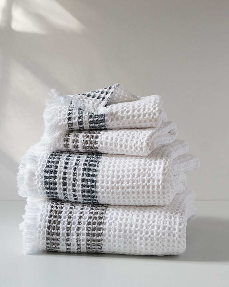 Mungo Organic Belgian Waffle Towels piled in a stack