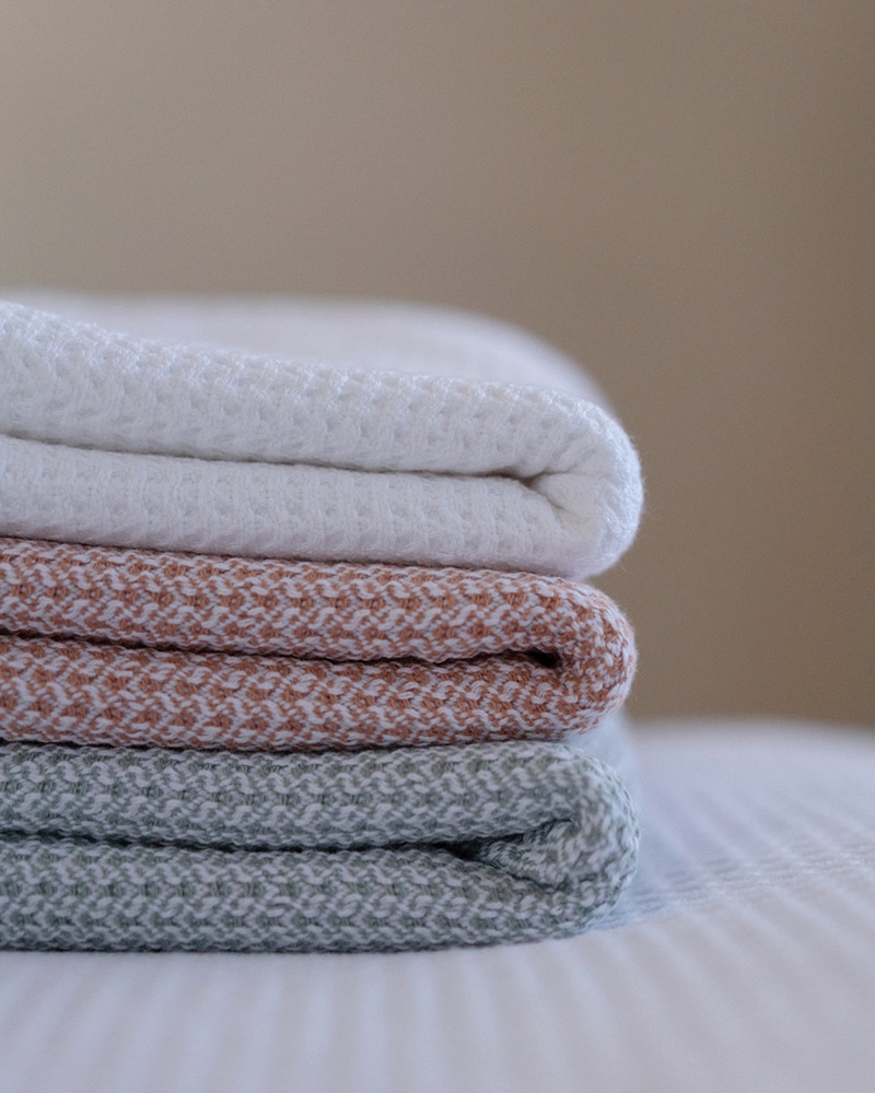 Stack of Mungo Organic Hooded Baby Towels