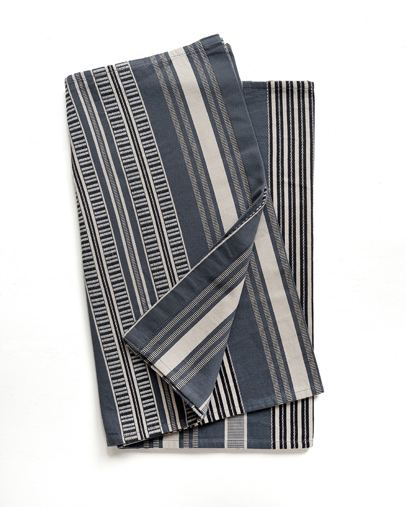 Close up of a Mungo Sahara Stripe Table Runner in Storm Cloud.