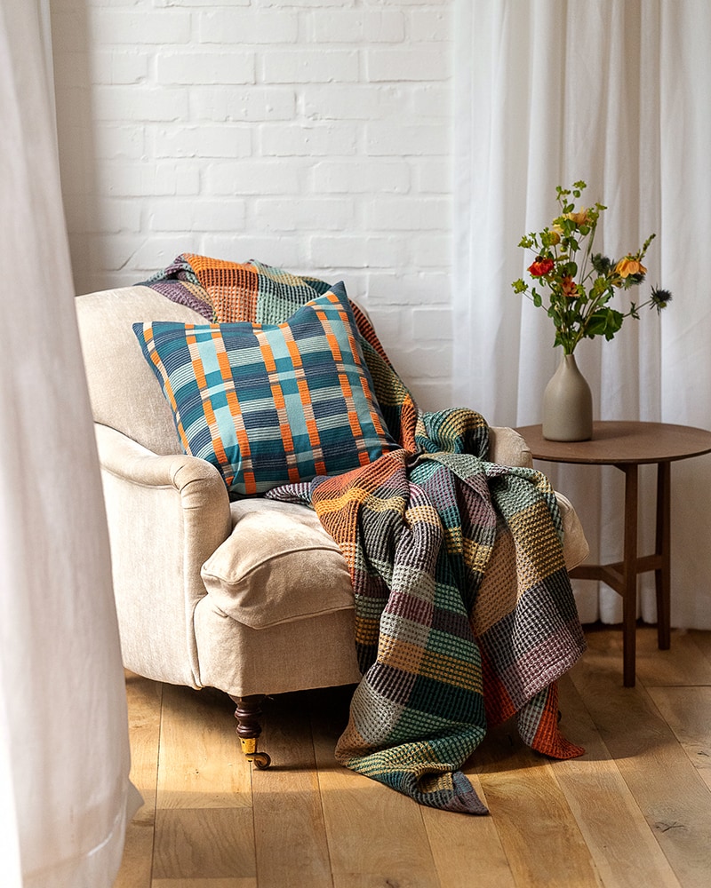 Mungo Skipping Block Cushion and Vrou Vrou on an armchair