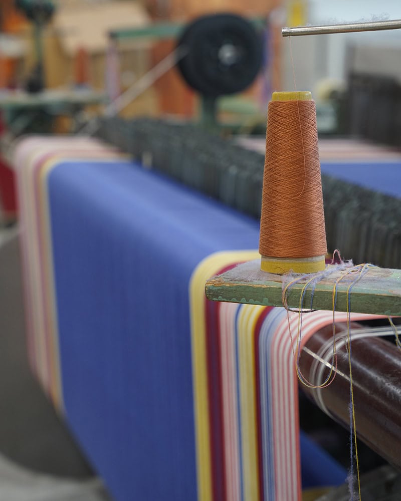 A cotton wrap being woven at the Mungo Mill