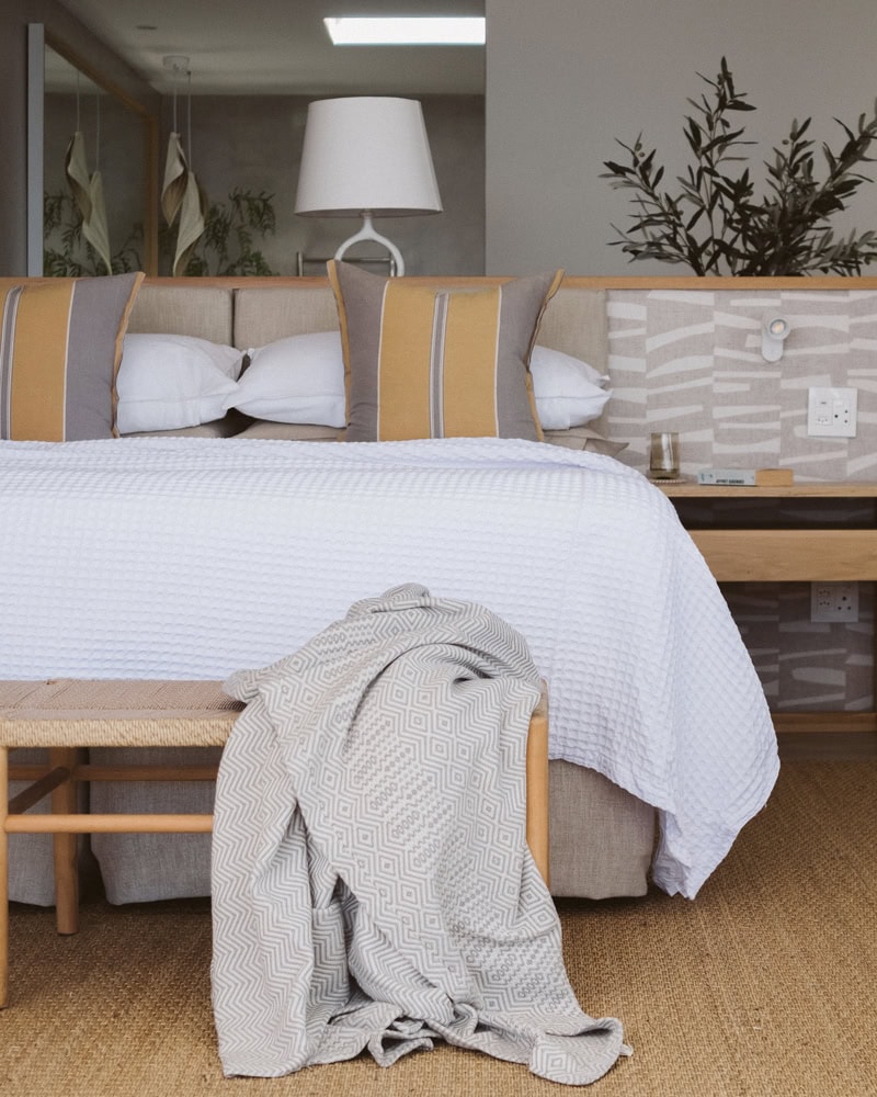 Barefoot Luxury is the Walkers Beach suites, topped with the Mungo Lattice Weave bed cover and the Bakuba throw