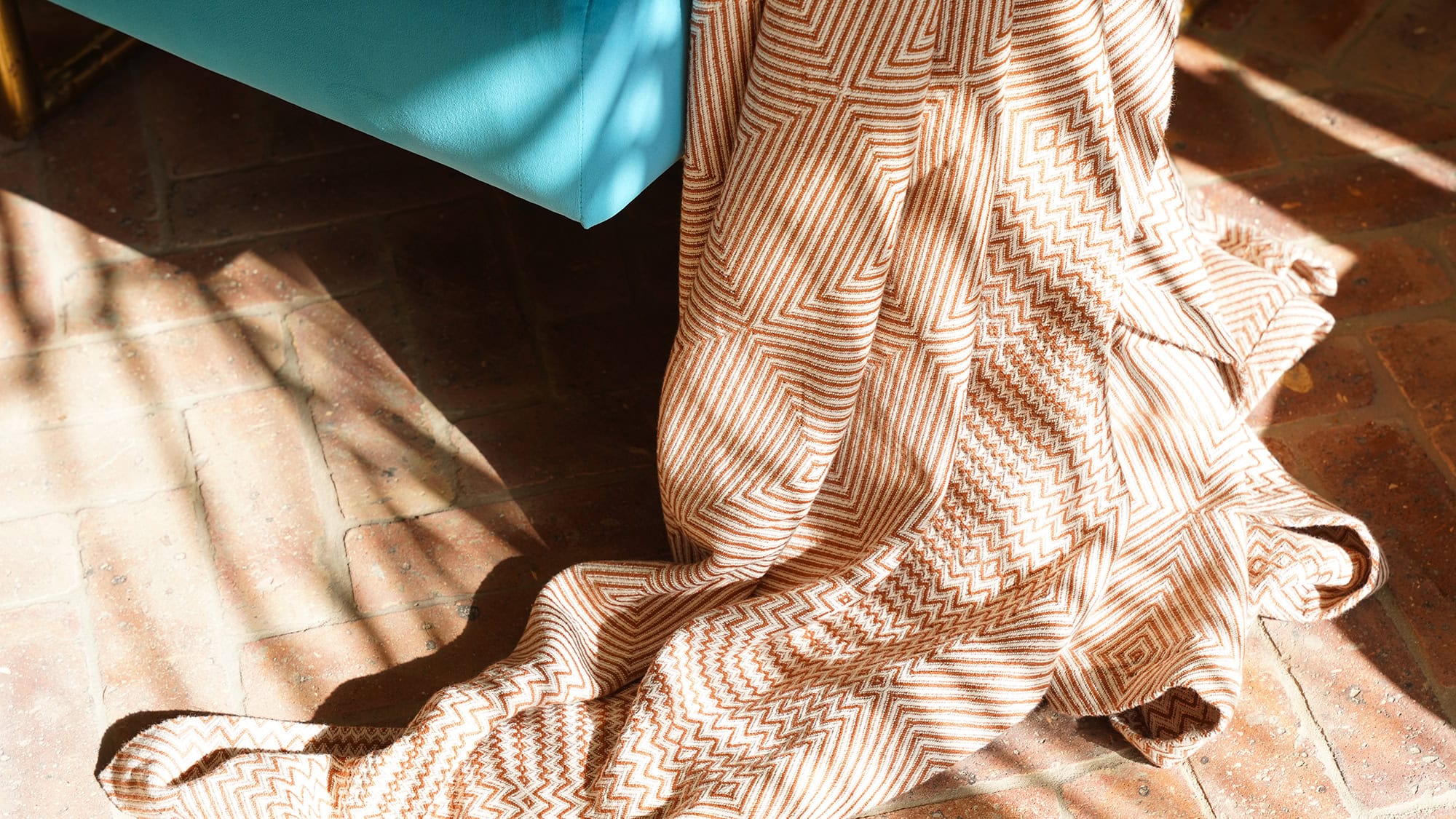 Feature Image of the cotton Whalebone throw. A 100% cotton blanket with an intricate African design