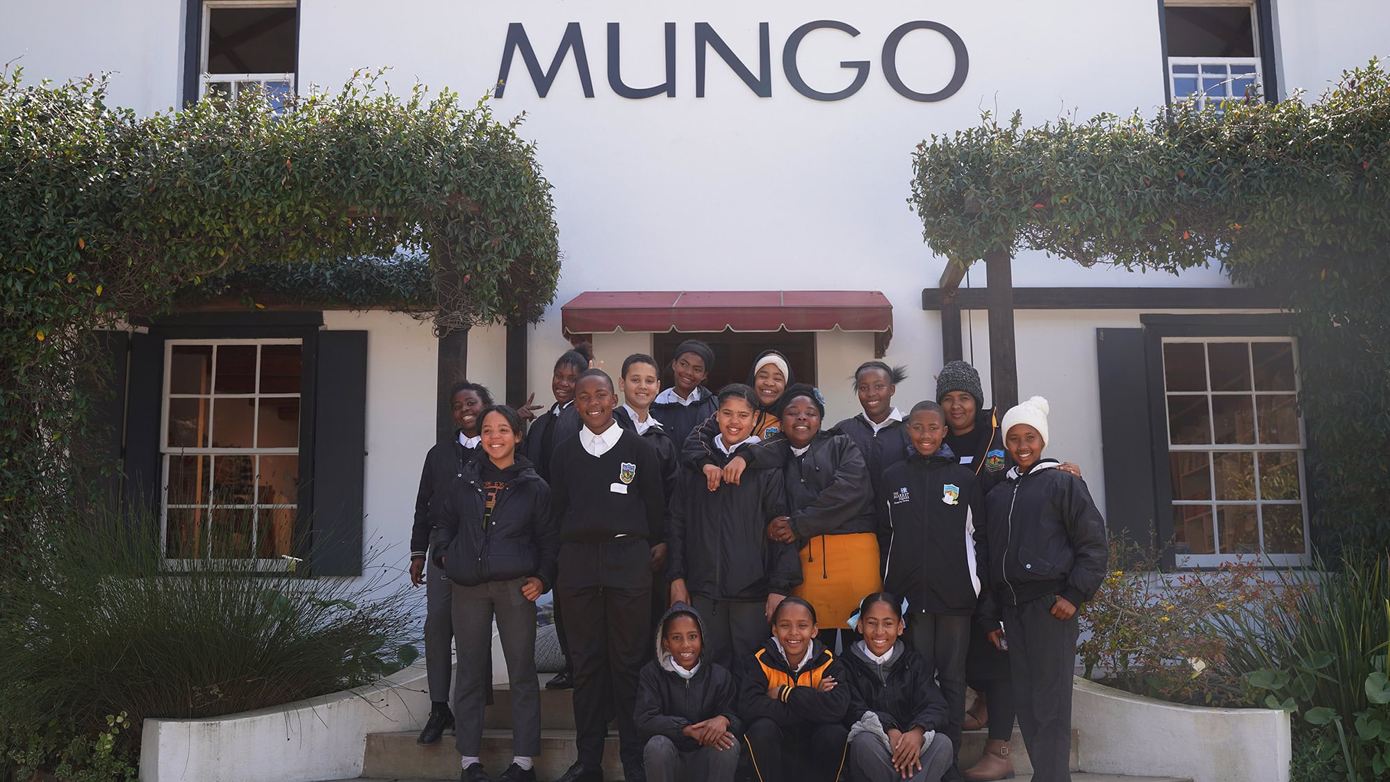 The 2024 Kids of Kurland Kikoi Class, outside the Mungo Mill.