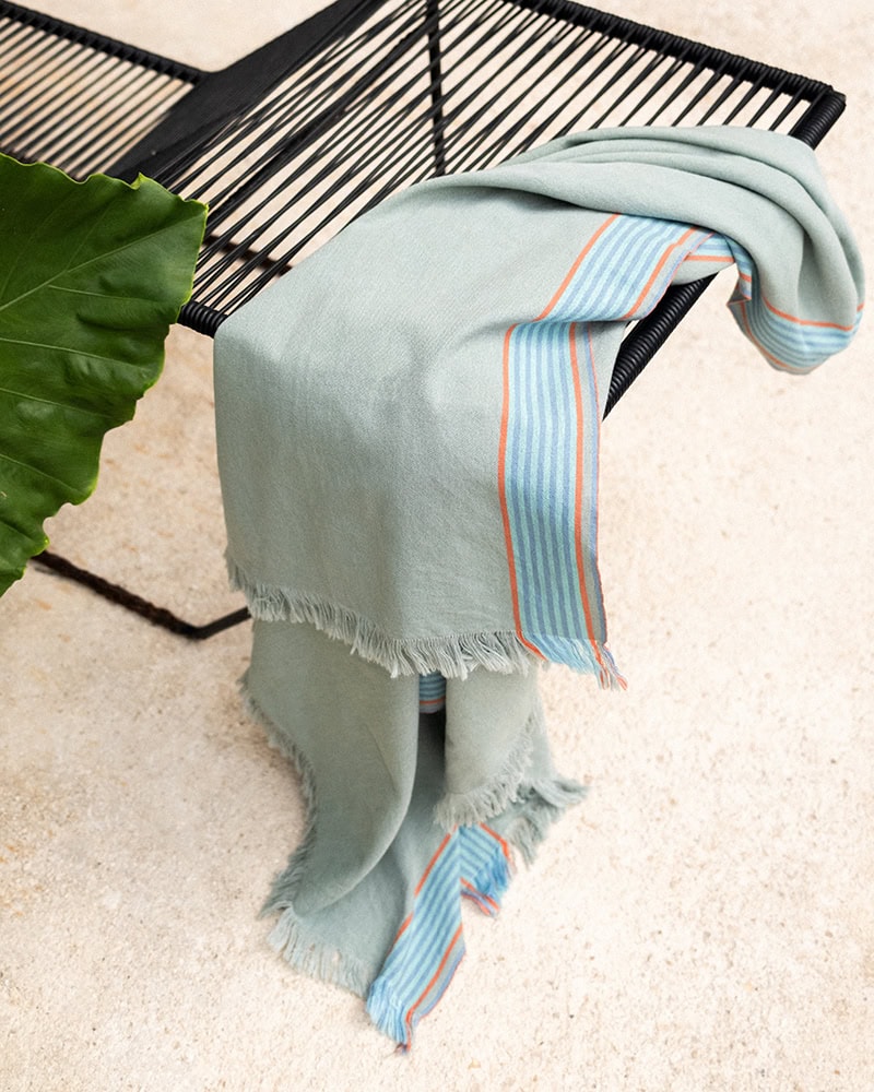 GOTS-Certified organic cotton Ruti Kikoi in Sage on a chair