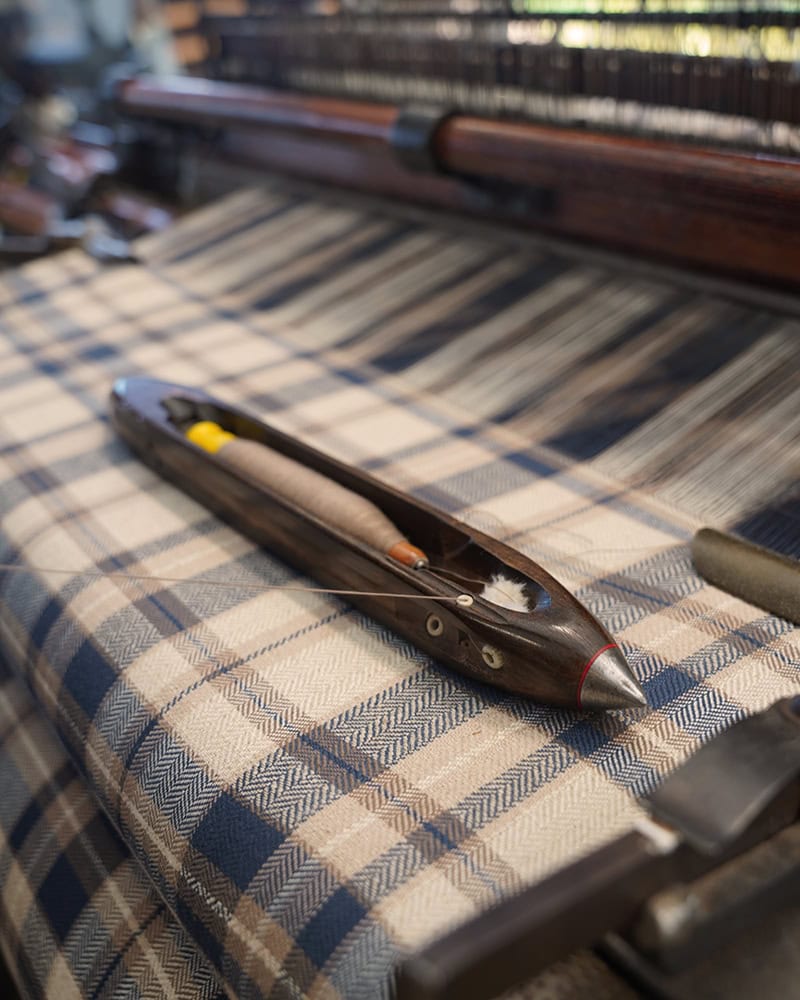 Weaving the Cook's Cloth on the Hattersley Loom with the Shuttle and Pern in view