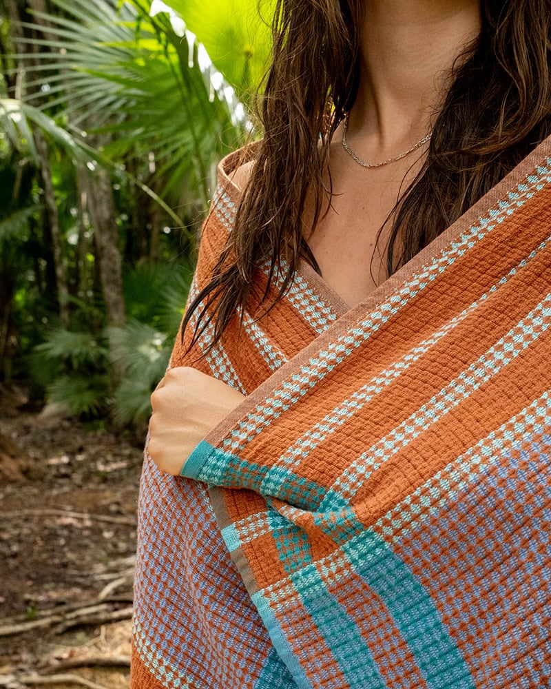 Model wrapping the Kitt Scout towel around her. Woven with GOTS-certified Organic Cotton.