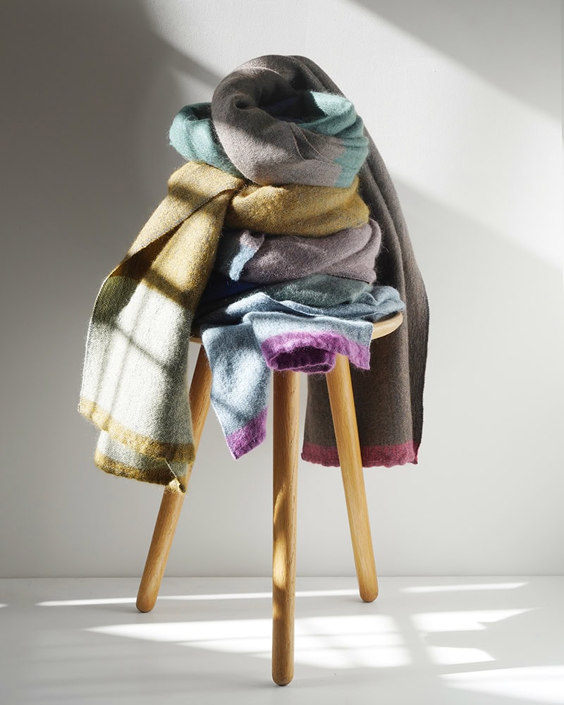 Mungo MOS wrap stacked on stool.